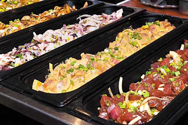 Assorted fresh poke from the lunch buffet.