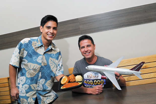 Zippy's employee Kevin Crutchfield and Vacations Hawaii sales and promotions manager Kevin Kaneshiro with Spaghetti & Chicken Mixed Plate ($6.99 fast-food, $7.99 restaurant) 