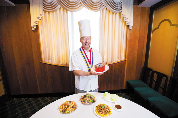 Executive chef Johnny Wong holds a large Gau ($12.95), which is available during Chinese New Year.