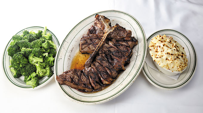 Steamed Broccoli ($14.95), Porterhouse for Two ($115.95), Lobster Mac ‘N Cheese ($16.95).