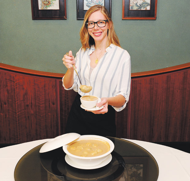 The editor, aka the Nutty Professor, scoops up Royal Garden's Walnut & Peanut Soup with Mochi Balls. 