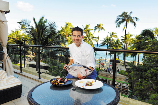 Executive chef Joseph Rose holds up a fresh skipjack tuna with some of his new menu creations.