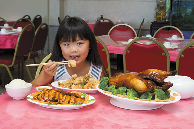 Ava Asari, 7, of Honolulu digs into Hung Won's family-friendly eats.