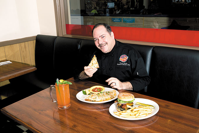 Corporate executive chef Dennis Franks with Breakfast Quesadilla with Homemade Salsa special ($9.99) and Beast Burger ($17.99)