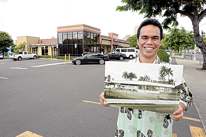 At the McCully Zippy's branch, manager Aka Castro shows a photo of the first Zippy's Restaurant before it opened in 1966 in the same area.