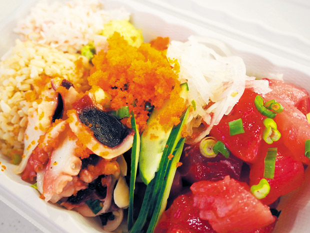 Medium PokeBox with fresh ahi, tako and an array of sides ($9.99). 