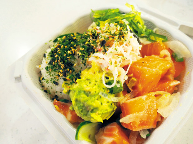 Small PokeBox with salmon, avocado, crab meat, ocean salad and furikake white rice ($7.99). 