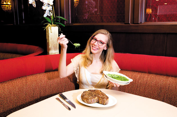 The editor scoops up a lavish bite of Creamed Spinach at Ruth's Chris, before diving into Porterhouse for Two.