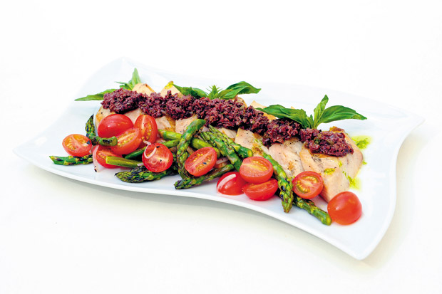 Grilled Mahimahi with olive tapenade, pesto, asparagus and tomatoes 