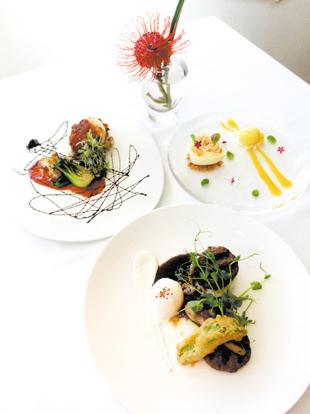 Foie Gras & Wagyu Loco Moco is flanked by Catch of the Day and Mango Cheesecake. Photo courtesy of The Kahala  