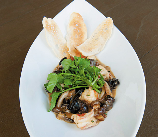 Escargot and Prawns is a happy-hour favorite and signature selection at Chef Chai. File photos